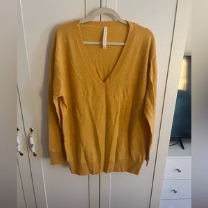 Aritzia 100% Merino V oversized V neck sweater in turmeric